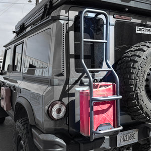 Close-up of Ineos Grenadier aluminum rear ladder with integrated jerry can holder, highlighting the secure mounting bracket and heavy-duty rung design.