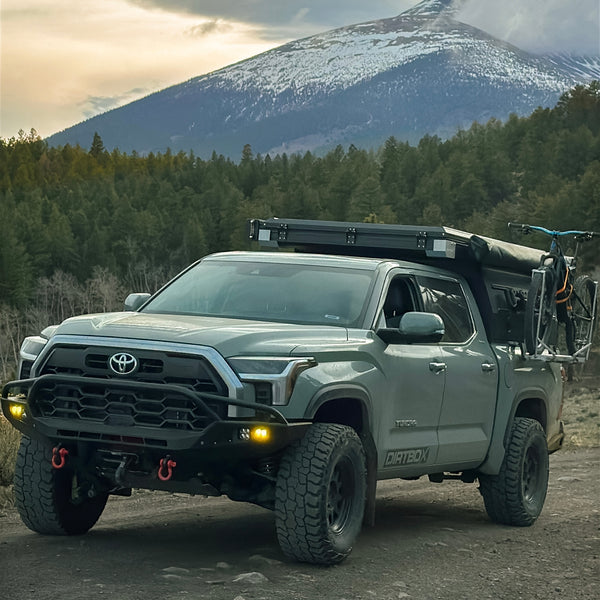 Side-mounted bike bracket installed on Toyota Tundra canopy camper